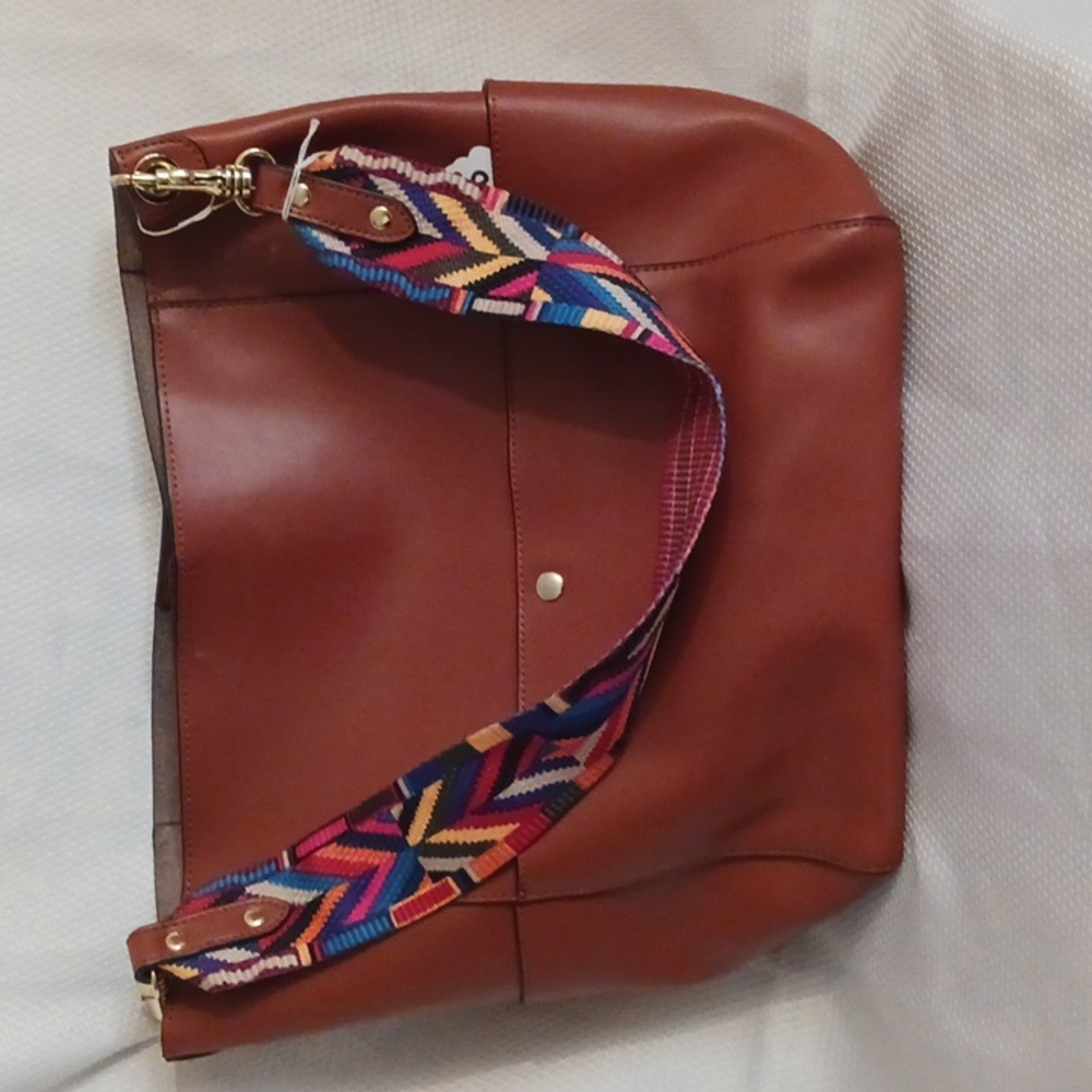 Tan  handbag with colorful strap